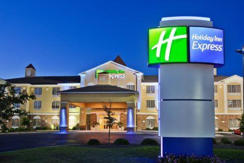 a hotel with a sign in front of a building at Holiday Inn Express Savannah Airport by IHG in Savannah