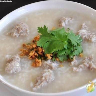 a bowl of soup with a green garnishment in it at Rawinnipha's Resort & Garden Khonkaen in Khon Kaen