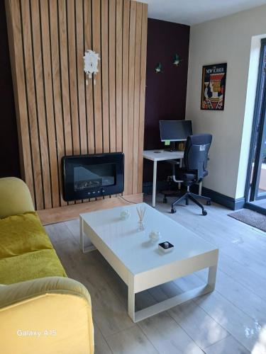 a living room with a couch and a coffee table at 2 bedroomed homely house in Manchester