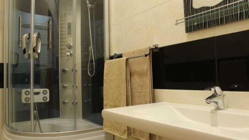 a bathroom with a sink and a shower at Ranga Holiday Resort in Bentota