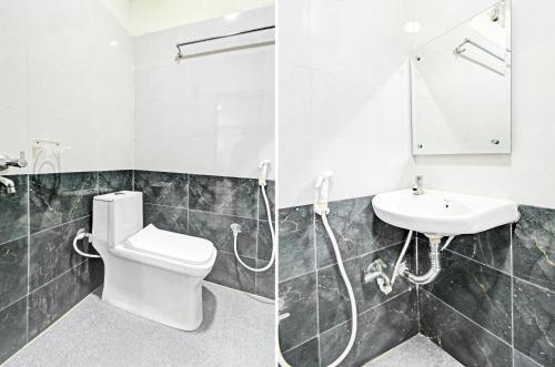 a bathroom with a toilet and a sink at Hotel O Mayur Inn in Surūrnagar