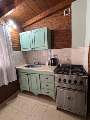 Kuchyň nebo kuchyňský kout v ubytování Náutico Apart Hotel