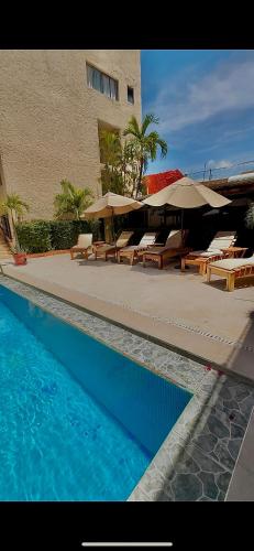 Der Swimmingpool an oder in der Nähe von Zihua Mia Hotel Boutique