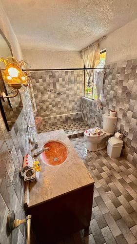 Ein Badezimmer in der Unterkunft Zihua Mia Hotel Boutique