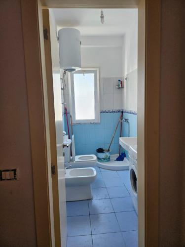 a bathroom with two toilets and a sink at Holidays Home Priam in Golem