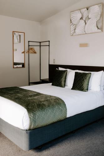 a bedroom with a large bed in a room at Te Mata Views Resort in Havelock North