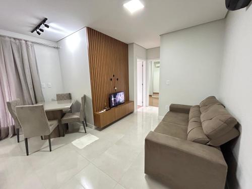 Televisyen dan/atau pusat hiburan di Apartamento no Icon by Bexap Stays