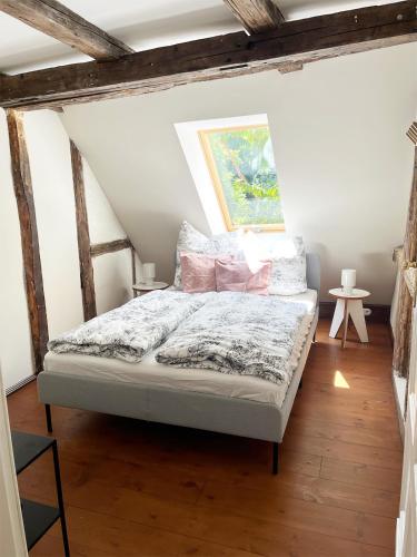 a bedroom with a bed in a attic at Große Wohnung in Marktnähe in Weißenfels