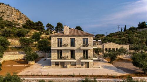 an aerial view of a house in a mountain at PALELIA living in the olive garden in Nafplio