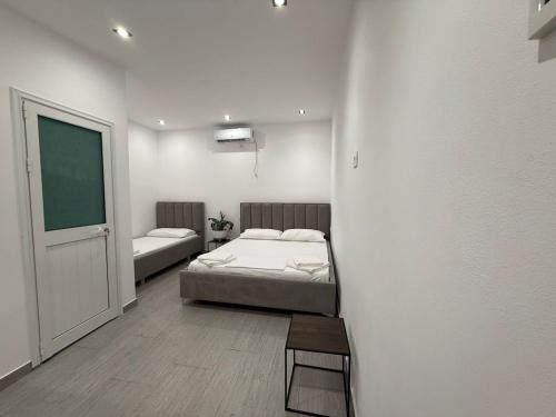 Ένα ή περισσότερα κρεβάτια σε δωμάτιο στο Vacation rooms