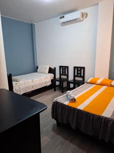 Postel nebo postele na pokoji v ubytování Casa Alexita