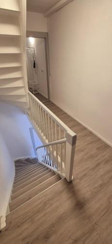 a staircase in a room with a stair case at Apartment Neckarglück in Edingen-Neckarhausen