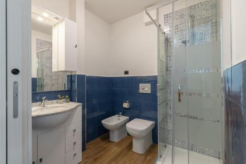 a bathroom with a toilet and a sink and a shower at Valentini Luxury Loft-18 by train to Florence-PARKING FREE in Prato