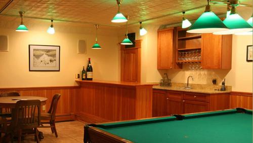 a kitchen with a pool table and a bar at Breezy Hill Inn in Fleischmanns