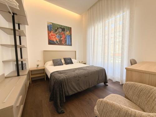 Apartamentos Mk77 León Zuloagaにあるベッド