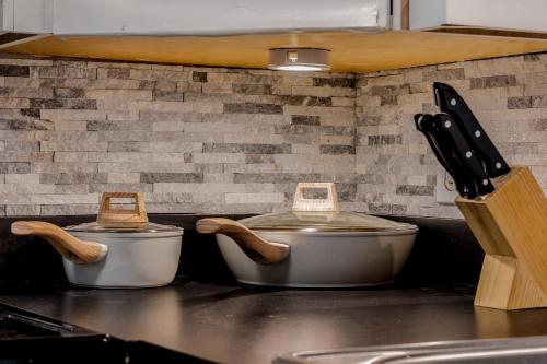 two pots sitting on a counter in a kitchen at Old San Juan Gateway Gem in San Juan