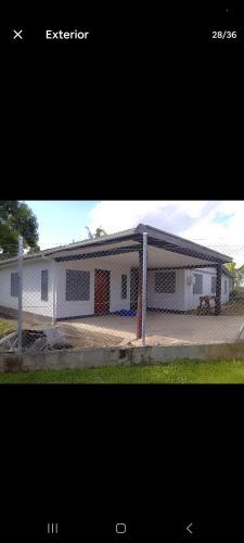 a white house with a gambrel roof at Aggies homestay in Nadi in Nadi International Airport
