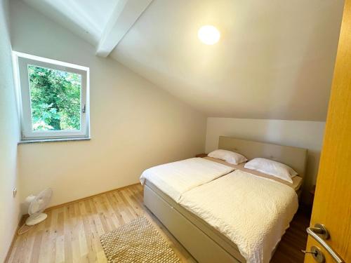 Postel nebo postele na pokoji v ubytování Apartments Rafael