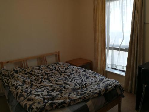 Ένα ή περισσότερα κρεβάτια σε δωμάτιο στο Bright Room Glasgow
