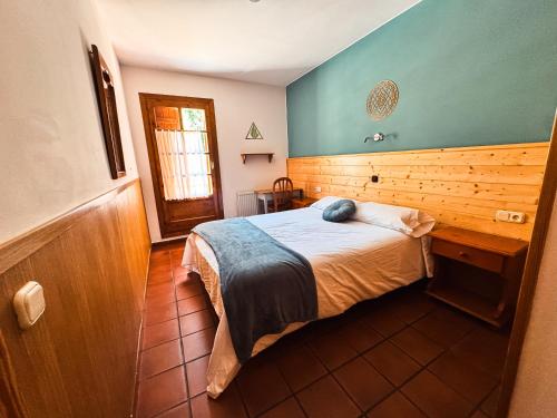 Katil atau katil-katil dalam bilik di Hotel de Montaña Uson
