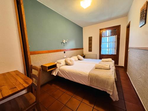 Katil atau katil-katil dalam bilik di Hotel de Montaña Uson