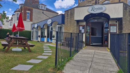 a picnic table in front of a building at The Ransdale in Bridlington