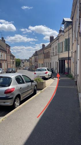 a street with cars parked on the side of the road at Sweet stay T2 in Dreux