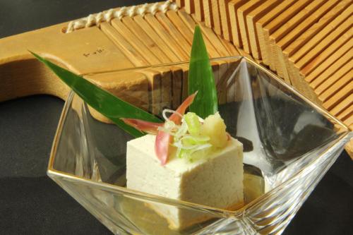 a piece of cake in a glass bowl at Gokayama Onsen Akaokan in Nanto