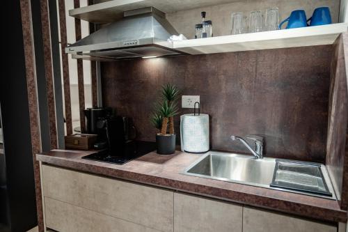 Η κουζίνα ή μικρή κουζίνα στο A&A Comfort Apartments