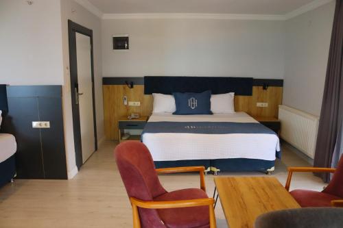 Una cama o camas en una habitación de HANN OTEL