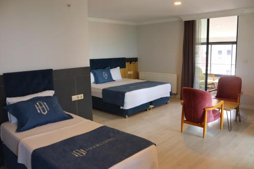 Una cama o camas en una habitación de HANN OTEL