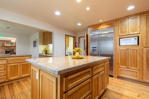 a large kitchen with wooden cabinets and a large island at Silver Rock Lodge home in Zephyr Cove
