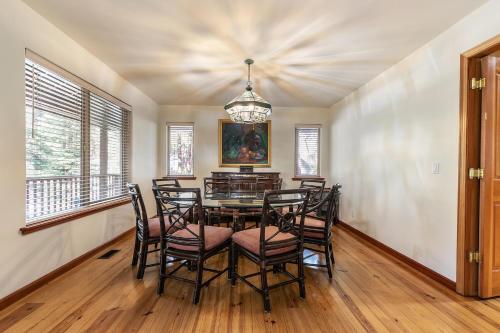 a dining room with a table and chairs at Silver Rock Lodge home in Zephyr Cove