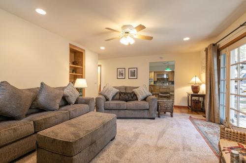 a living room with a couch and a ceiling fan at Silver Rock Lodge home in Zephyr Cove