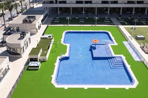 Apartamento con Vistas al mar, Piscina y Pista de Paddle