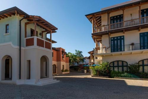 a building with a balcony on the side of it at Santarena Hotel at Las Catalinas in Playa Flamingo