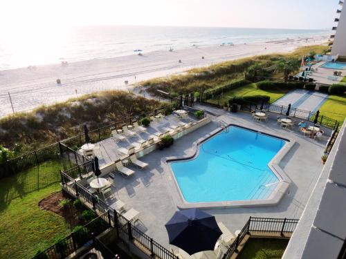 an overhead view of a swimming pool and the beach at Mariner East in Panama City Beach