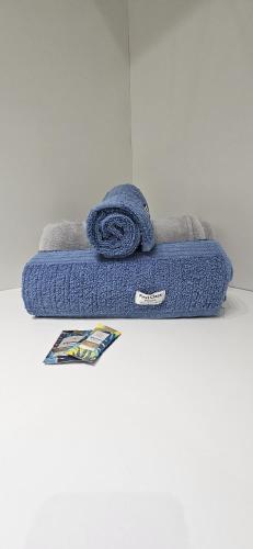 a blue towel sitting on top of a floor at Um lugar de charme e aconchego - Rosa! in Brasília