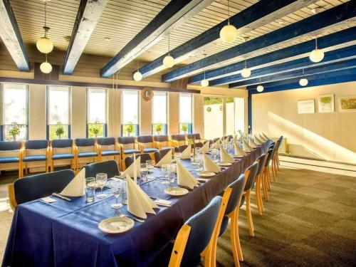 a long dining room with a long table and chairs at 4 person holiday park home in Give in Give
