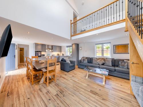 a large living room with a table and a couch at Ty Godro - Uk12745 in Acrefair