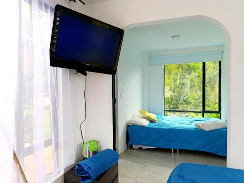 En eller flere senge i et værelse på Habitaciones campestres 202