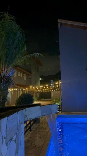 Bazén v ubytování POUSADA OHANA, SUITES ao LADO DO SESC BERTIOGA, e PROXIMO A PRAIA nebo v jeho okolí