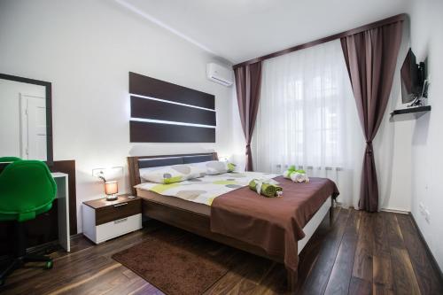 a bedroom with a bed and a large window at VisitZagreb Emerald in Zagreb