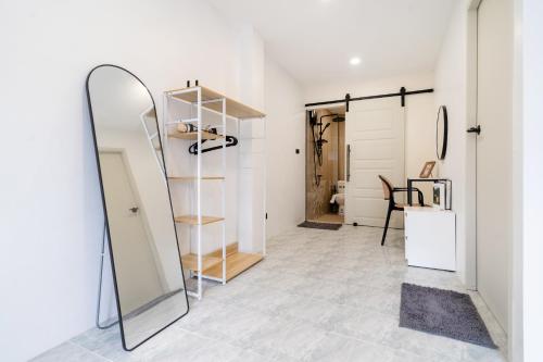 a dressing room with a mirror and a closet at Wink 3 Patong Beach Phuket sleep 8 in Ban Nong Chaeng