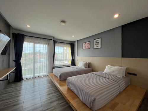 Postel nebo postele na pokoji v ubytování Sor Kor Sor Resort