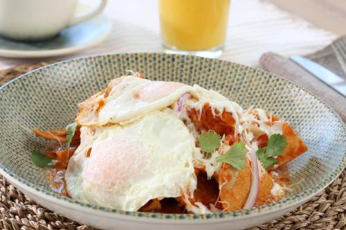 a bowl of food with an egg on top at Holiday Inn Navojoa by IHG in Navojoa