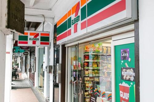 a store front of a grocery store with its doors open at A Hotel Chinatown- Stay From 8PM To 9AM in Singapore
