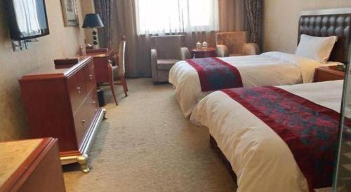 Ένα ή περισσότερα κρεβάτια σε δωμάτιο στο Metropark Hotel