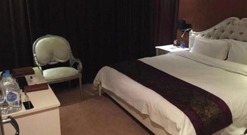 Ένα ή περισσότερα κρεβάτια σε δωμάτιο στο Metropark Hotel