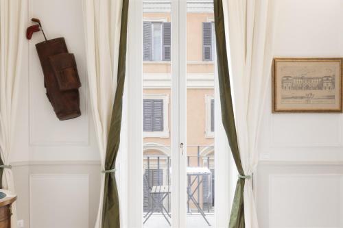a window with a view of a building at Relais Donna Lucrezia in Rome